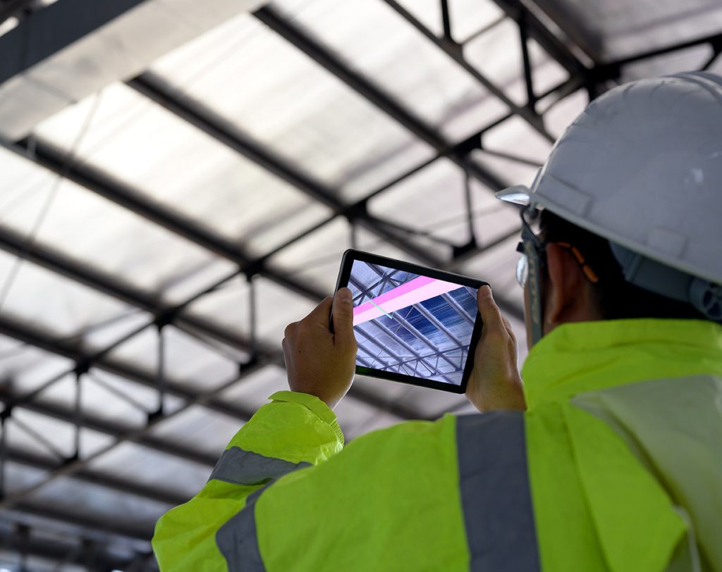 Construction Civil Engineer use technology software through tabl