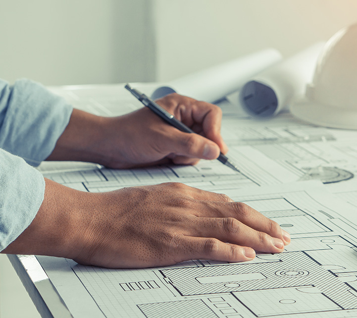 man architect drawing on architectural project.Architect drawing